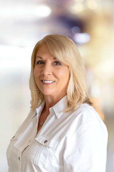 Portrait of Evie Grady, REALTOR®.